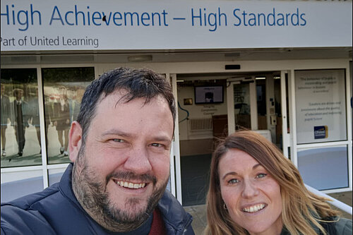 Rich and Olivia outside school