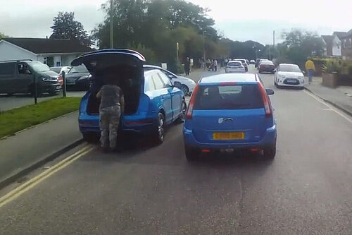 badly parked cars outside school